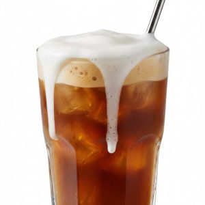 Glass of iced coffee topped with creamy cold foam